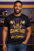 Man and woman wearing black LSU Tigers roaring tiger drip art graphic tees in purple and gold